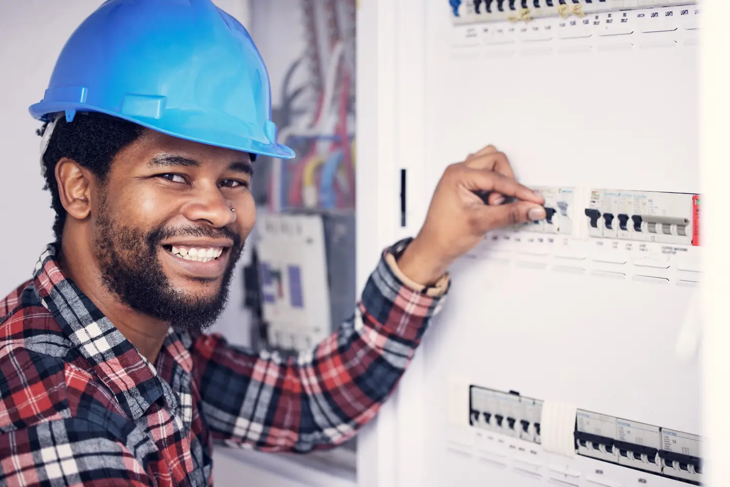 Qualified electrician inspecting a residential electrical distribution board Qualified electrician inspecting a distribution board in Gauteng